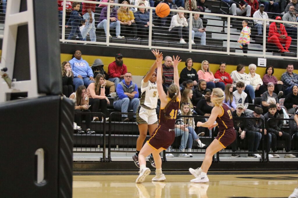 Oxford’s Jamea Gaston launches a 3-pointer of the defense of Spring Garden’s Maggie Jarrett. Gaston hit the shot to give the Lady Jackets a six-point lead with less than 90 seconds to play. (Photos by Mike Lett/Lett’s Focus Photography)