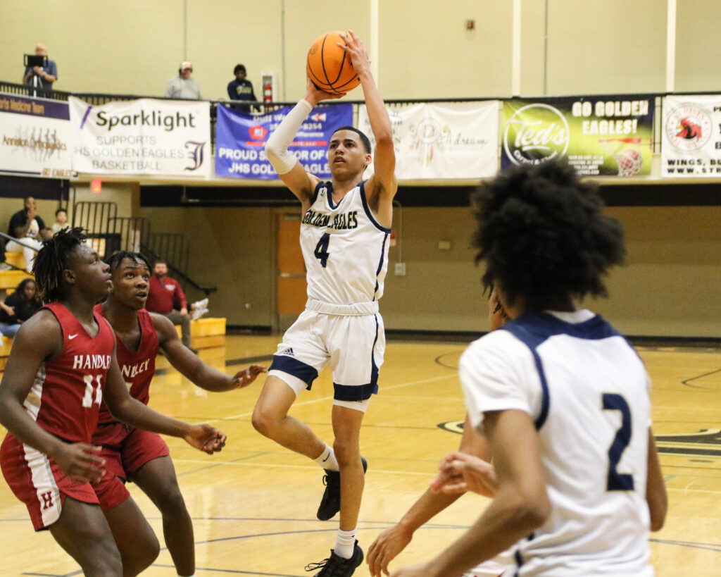 Jacksonville’s Devin Barksdale goes up for two of his 20 points against Handley on Tuesday at Jacksonville. (Photo by Greg Warren)