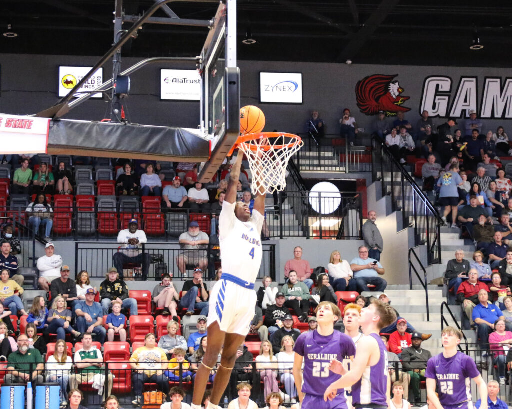 Piedmont’s Ish Bethel goes up for a dunk against Geraldine in their Class 3A Northeast Regional semifinal Monday in Pete Mathews Coliseum. (Photo by Greg Warren)