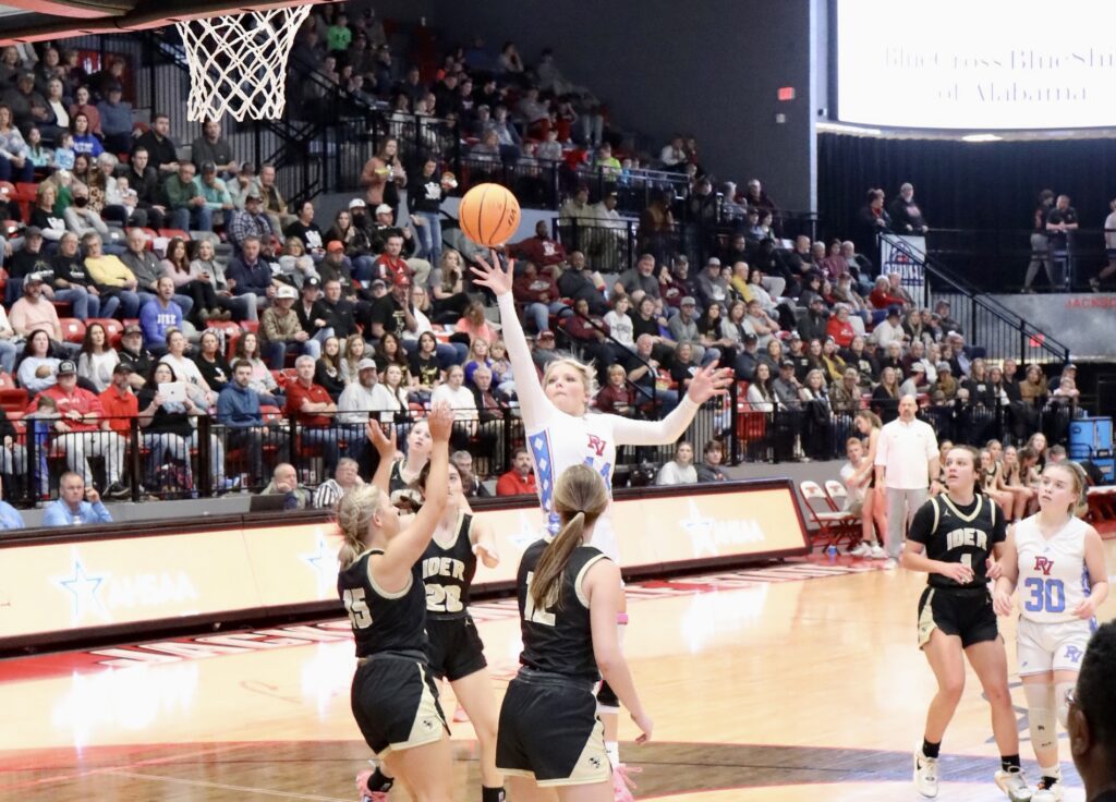 Pleasant Valley’s Macey Roper goes over a tightly packed Ider defense for a shot in the lane. Roper finished with 24 points and 17 rebounds in her final high school game as the Lady Raiders fell in the Northeast Regionals 63-49. (Photo by Krista Larkin)
