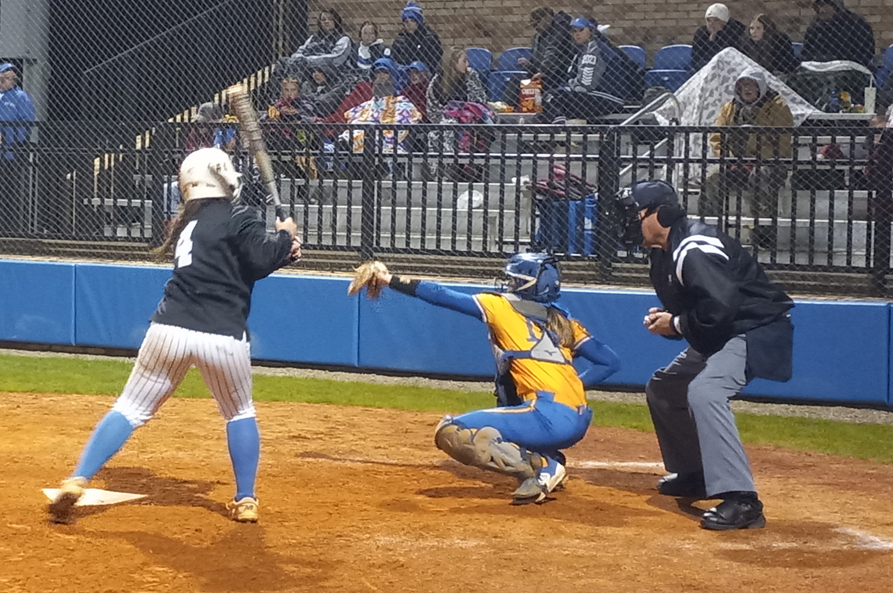 Piedmont catcher Jenna Calvert frames one up as White Plains’ Callie Richardson looks on during their game in the Piedmont Invitational on Saturday. (Photo by Joe Medley)