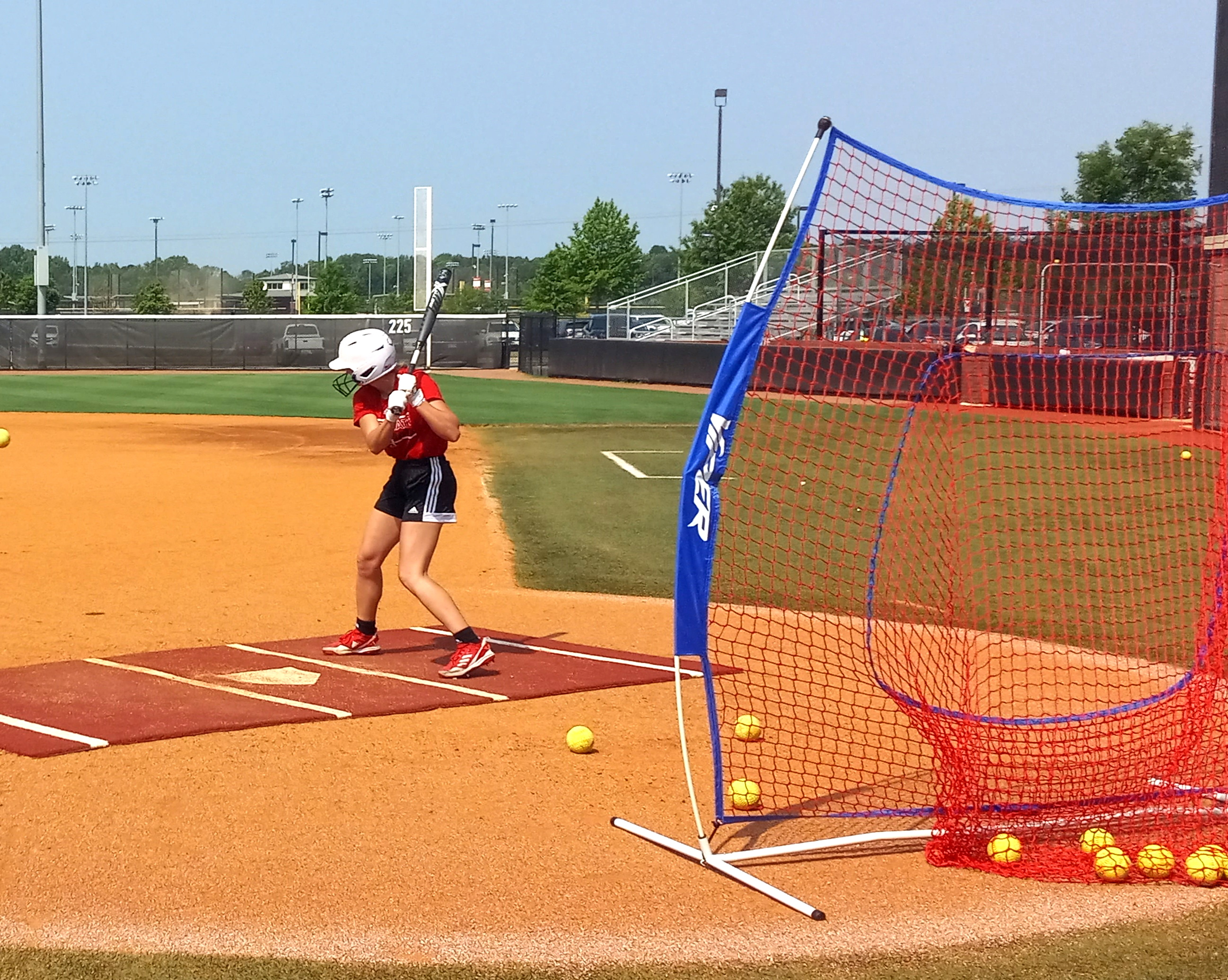 Former White Plains High School and current Jacksonville State University player Emma Jones sizes up a pitch during Wednesday’s Smash it Sports Vipers practice at Choccolocco Park. (Photo by Joe Medley)