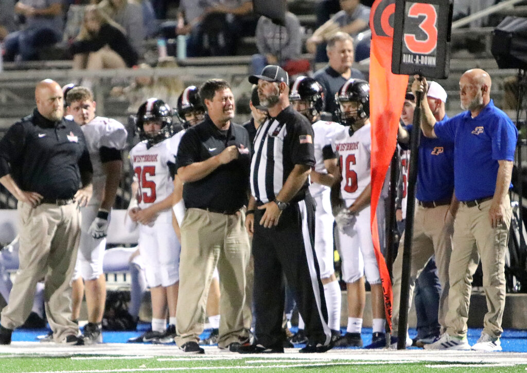 First-year Westbrook Christian coach Steve Smith talks to a referee during the Warriors’ game at Piedmont on Friday. Smith coached Piedmont from 2006-22, leading the Bulldogs to five state titles. (Photo by Jean Blackstone/For East Alabama Sports Today)