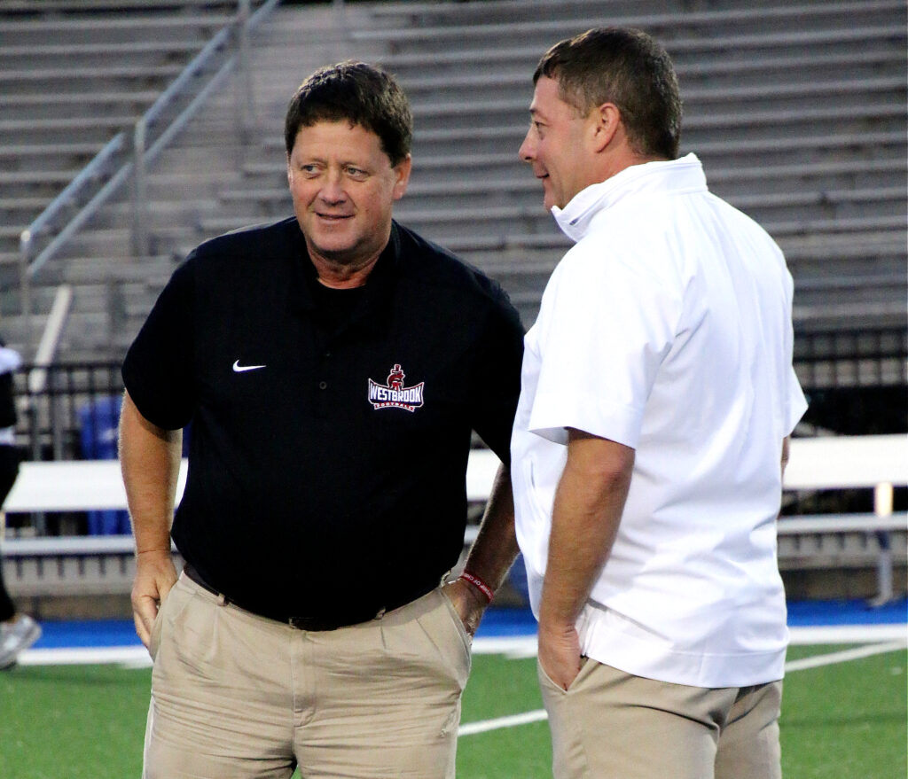 Westbrook Christian coach Steve Smith and Piedmont’s Jonathan Miller share a moment before their game Friday at Piedmont. (Photo by Jean Blackstone/For East Alabama Sports Today)