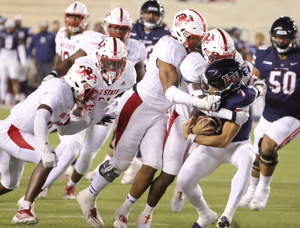 Jax State comes up with a sack of Liberty quarterback Kaidon Salter during their game Tuesday on Burgess-Snow Field. (Submitted photo)