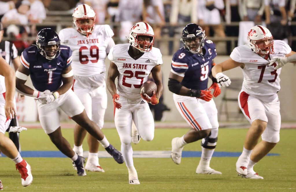 Jax State running back Anwar Lewis runs for yardage against Liberty on Tuesday. (Submitted photo)