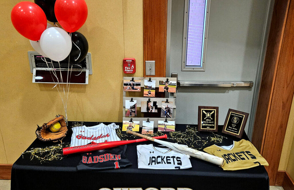 Reagan Sanders’ memorabilia display for Monday’s ceremony to mark her signing to play softball for Gadsden State Community College. (Photo by Joe Medley)