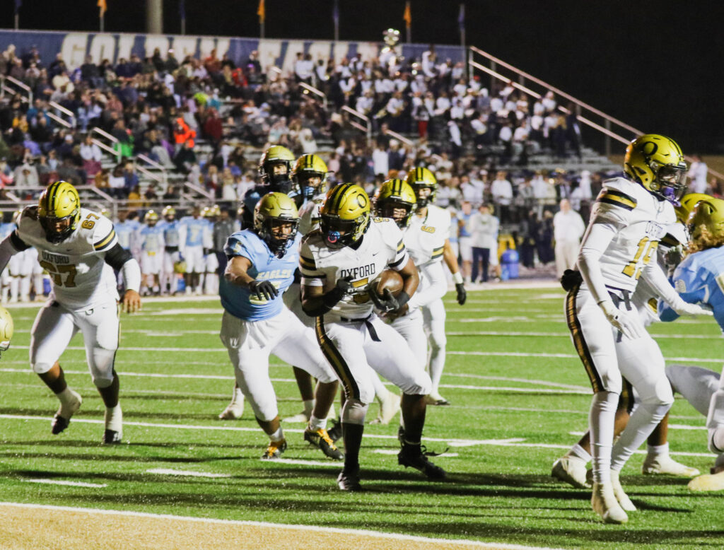 Oxford’s Jaydon Thomas turns for the end zone at Jacksonville on Friday. (Photo by Greg Warren/For East Alabama Sports Today)