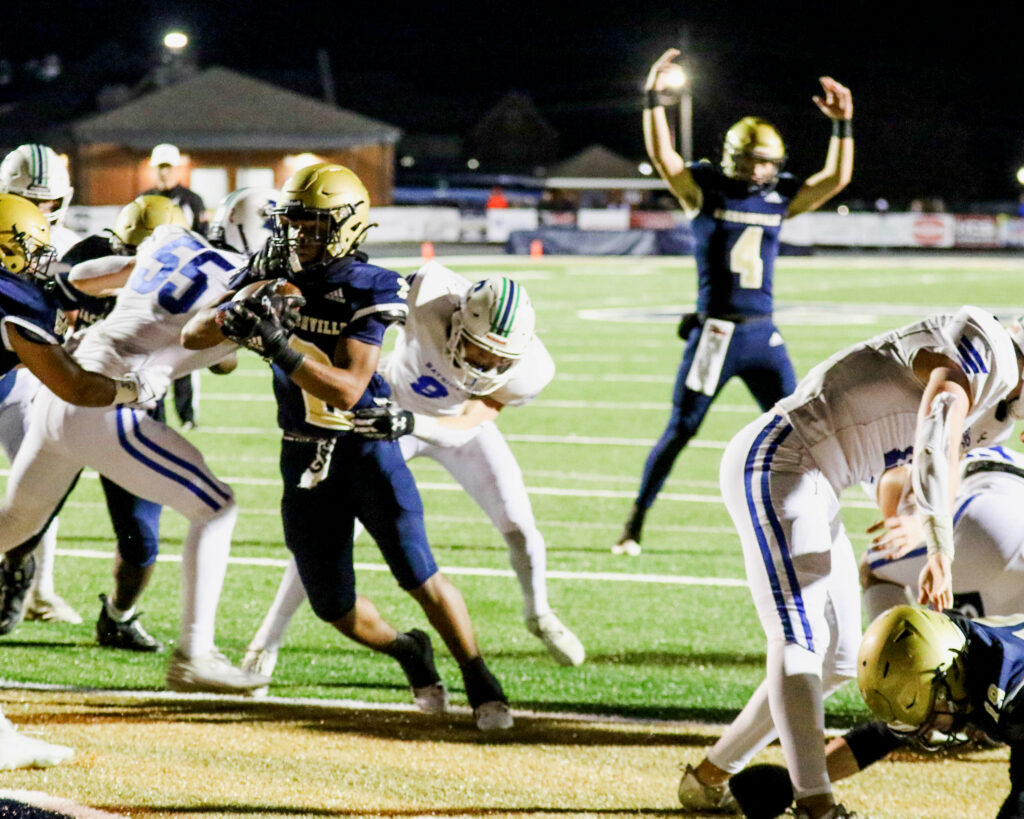Jacksonville’s Zae English scores on a 1-yard touchdown run as quarterback Jim Ogle signals touchdown during their 35-7 victory over Bayside Academy on Friday at Golden Eagle Stadium. (Photo by Greg Warren/For East Alabama Sports Today)