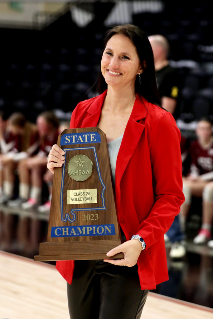 Retiring Pleasant Valley head coach Dana Bryant holds the state-championship trophy after the Raiders beat Sand Rock in Wednesday’s Class 2A state final in Birmingham’s Bill Harris Arena. (Photo by Krista Larkin/For East Alabama Sports Today)