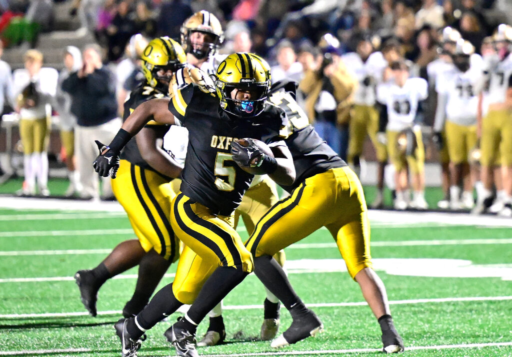 Oxford’s Jaydon Thomas breaks through for a touchdown run against Athens in Friday’s first-round playoff game on Lamar Field. (Photo by B.J. Franklin/Gunghophotos.com)