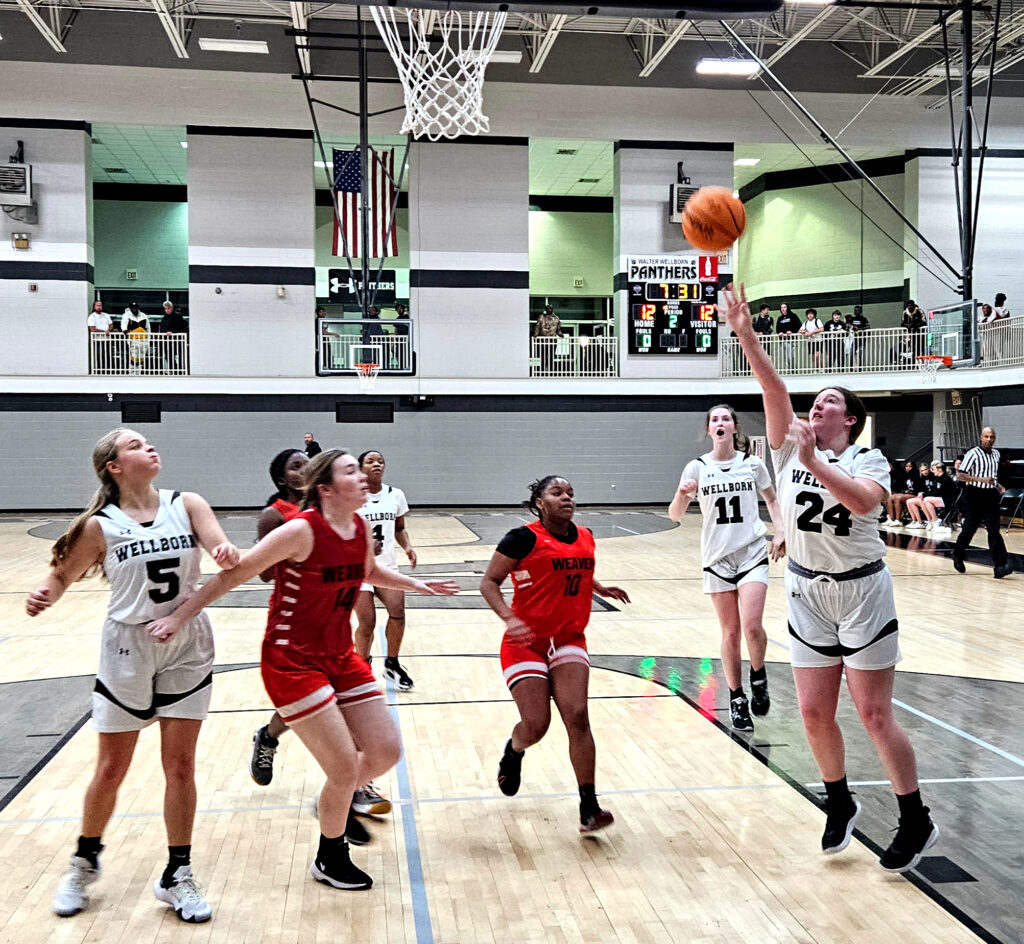 Wellborn’s Hannah Grubbs scores against Weaver during their game Tuesday at Wellborn. (Photo by Joe Medley)