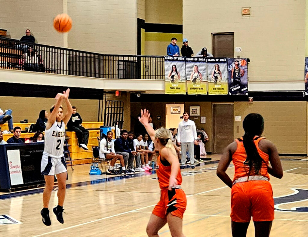 Jacksonville’s Halaina Lozano shoots a 3-pointer on the way to scoring 10 points against Alexandria on Monday at Jacksonville. (Photo by Joe Medley)