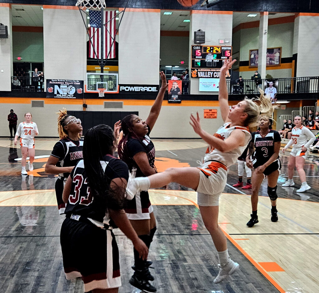 Alexandria’s Charlee Parris tries a fallaway shot against Anniston on Tuesday at Alexandria. (Photo by Joe Medley)