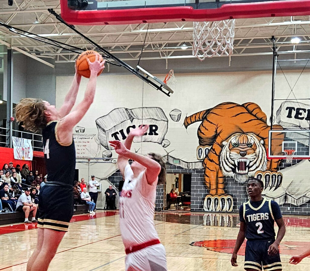 Randolph County’s Gavin Wortham pulls down a rebound against Ohatchee during the Heflin Holiday Hoops Classic on Wednesday. (Photo by Joe Medley)