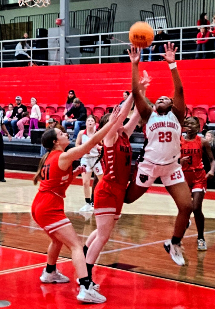 Cleburne County’s Faith Brown goes up for two of her 33 points against Weaver during Wednesday’s action in the Heflin Holiday Hoops Classic. (Photo by Joe Medley)