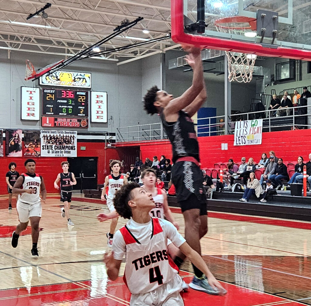 Weaver’s KeShawn Allen gets a fast break layup against Cleburne County during Wednesday’s action in the Heflin Holiday Hoops Classic. (Photo by Joe Medley)