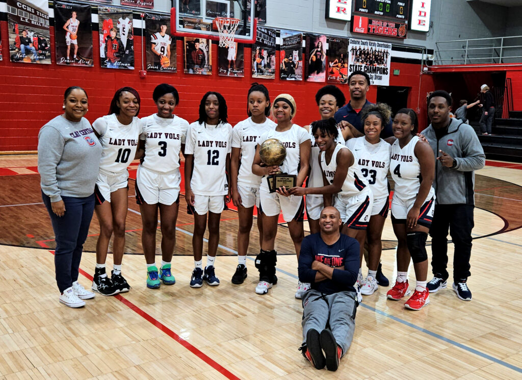 Central-Clay’s girls celebrate their second tournament title this season Friday, after beating Randolph County in the Heflin Holiday Hoops Classic final.