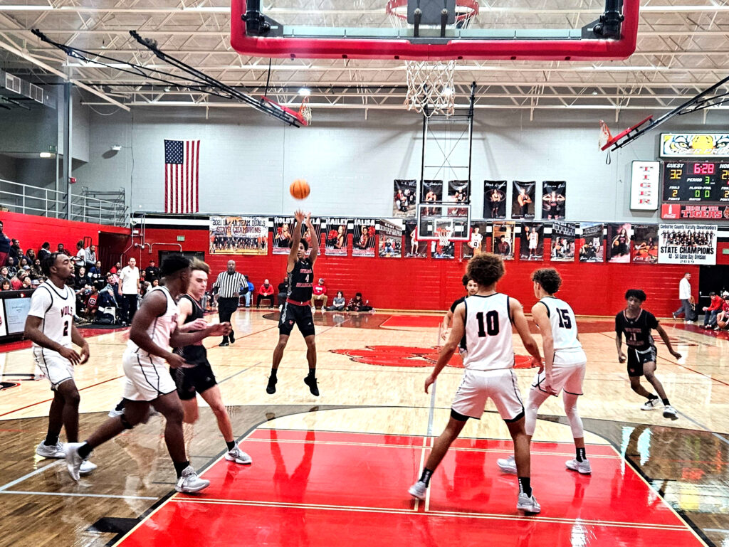 Weaver’s KeShawn Allen hits a 3-pointer on his way to 13 points against Central-Clay on Friday. (Photo by Joe Medley)