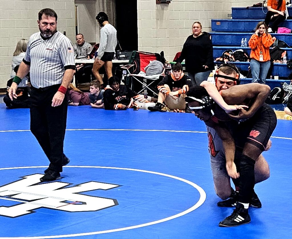 Alexandria’s Tristen Page works toward his upset pin of Weaver’s Dashawn Barnes in Wednesday’s 152-pound Calhoun County final at White Plains High School. It was a key moment in Alexandria’s narrow victory over Weaver in the team standings. (Photo by Joe Medley)