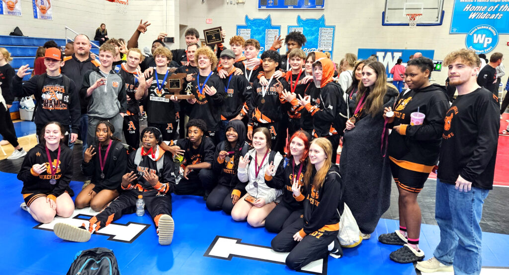 Alexandria celebrates the school’s third consecutive Calhoun County title in boys’ wrestling Wednesday at White Plains High School. (Photo by Joe Medley)