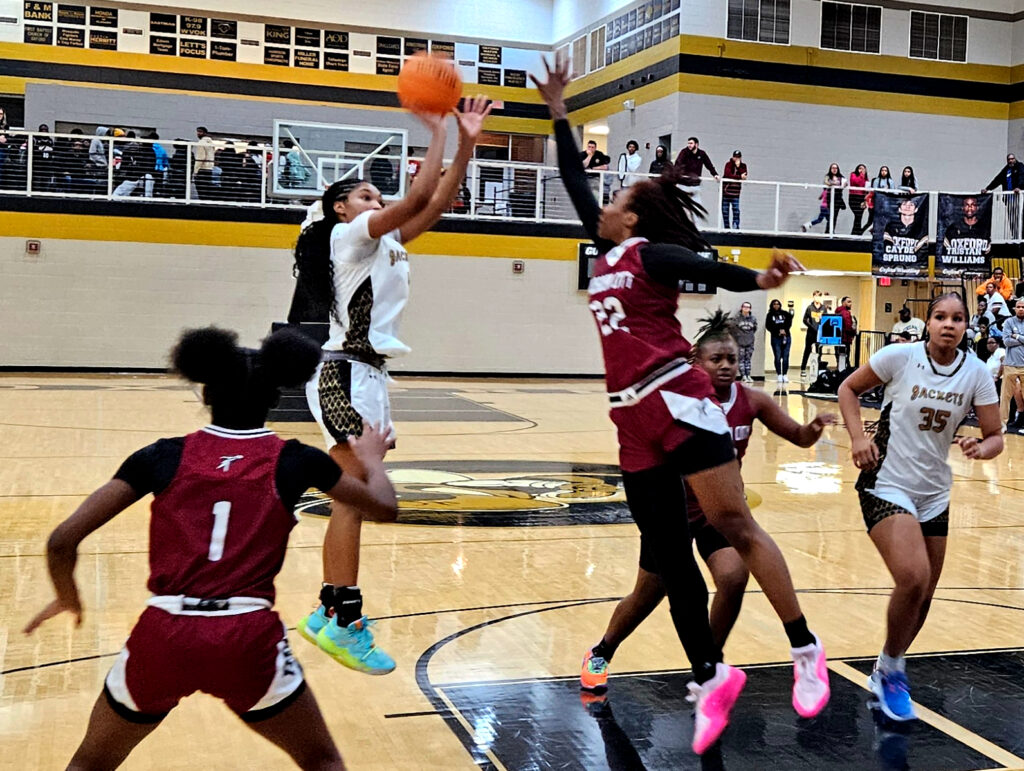 Xai Whitfield shoots on the way to 37 points against Gadsden City on Friday at Oxford. She scored 28 points in the second half. (Photo by Joe Medley)