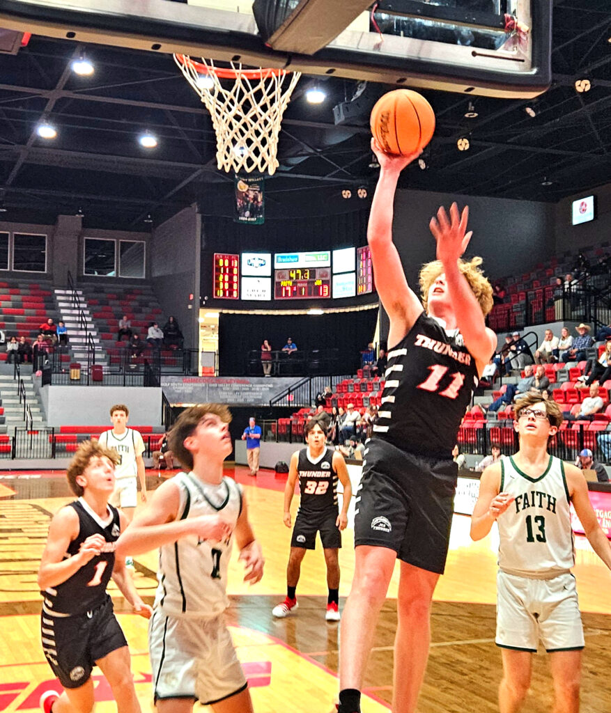 Jacksonville Christian’s Noah Lee goes up for two of his 32 points against Faith Christian on Saturday. (Photo by Joe Medley)