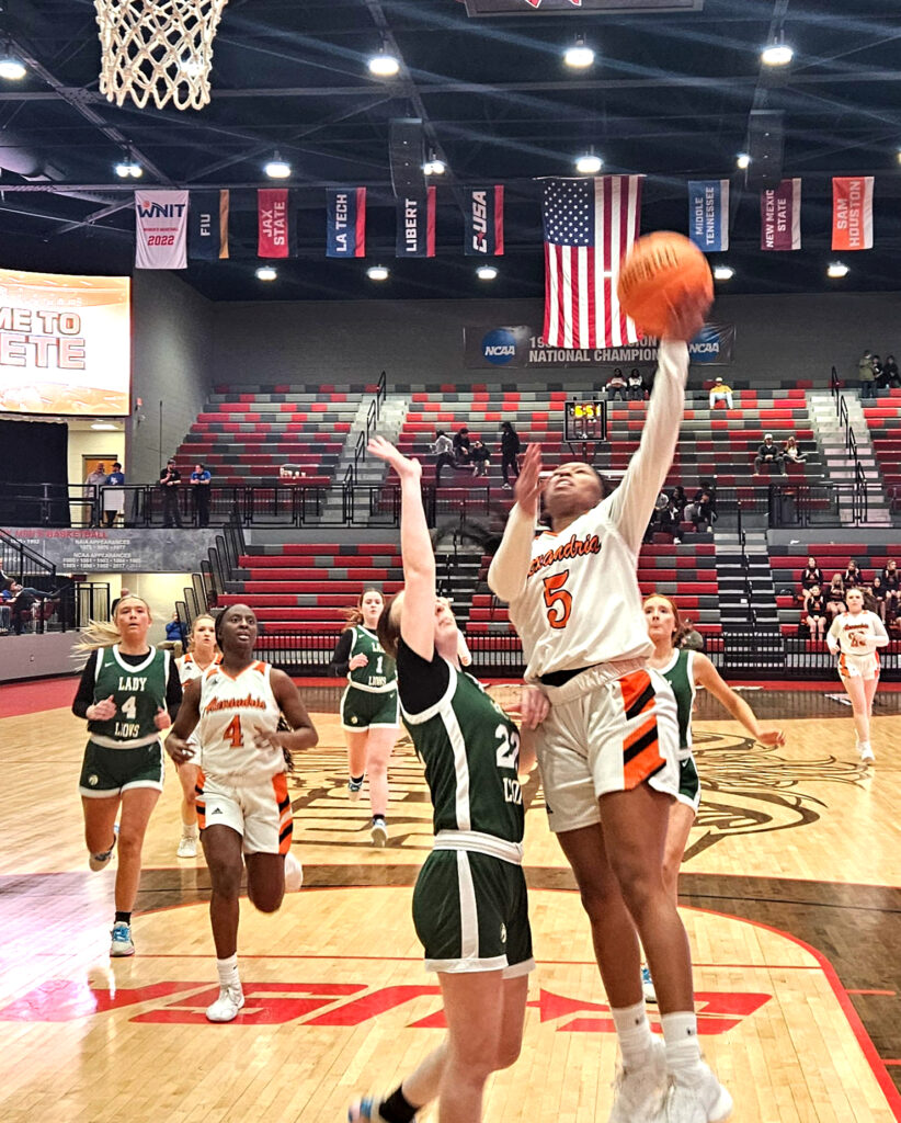 Alexandria’s Makayla Brewster goes up for a fastbreak layup against Faith Christian in Monday’s Calhoun County tournament action in Pete Mathews Coliseum. (Photo by Joe Medley)