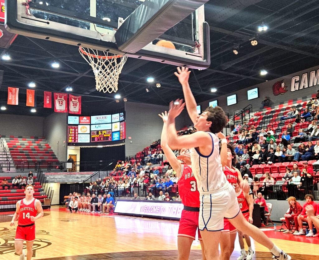 White Plains’ Carter Johnson goes up for two against Ohatchee during Monday’s Calhoun County tournament action in Pete Mathews Coliseum. (Photo by Joe Medley)