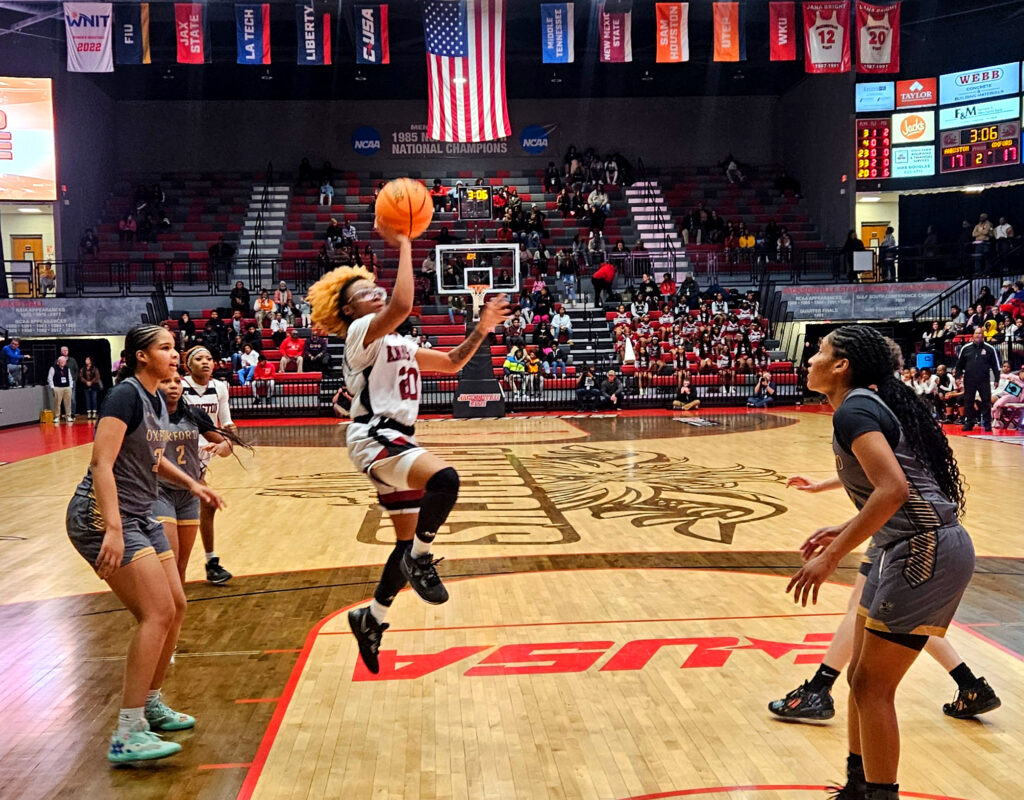 Anniston’s Jada Fomby drives against Oxford in Friday’s Calhoun County championship game in Pete Mathews Coliseum. (Photo by Joe Medley)