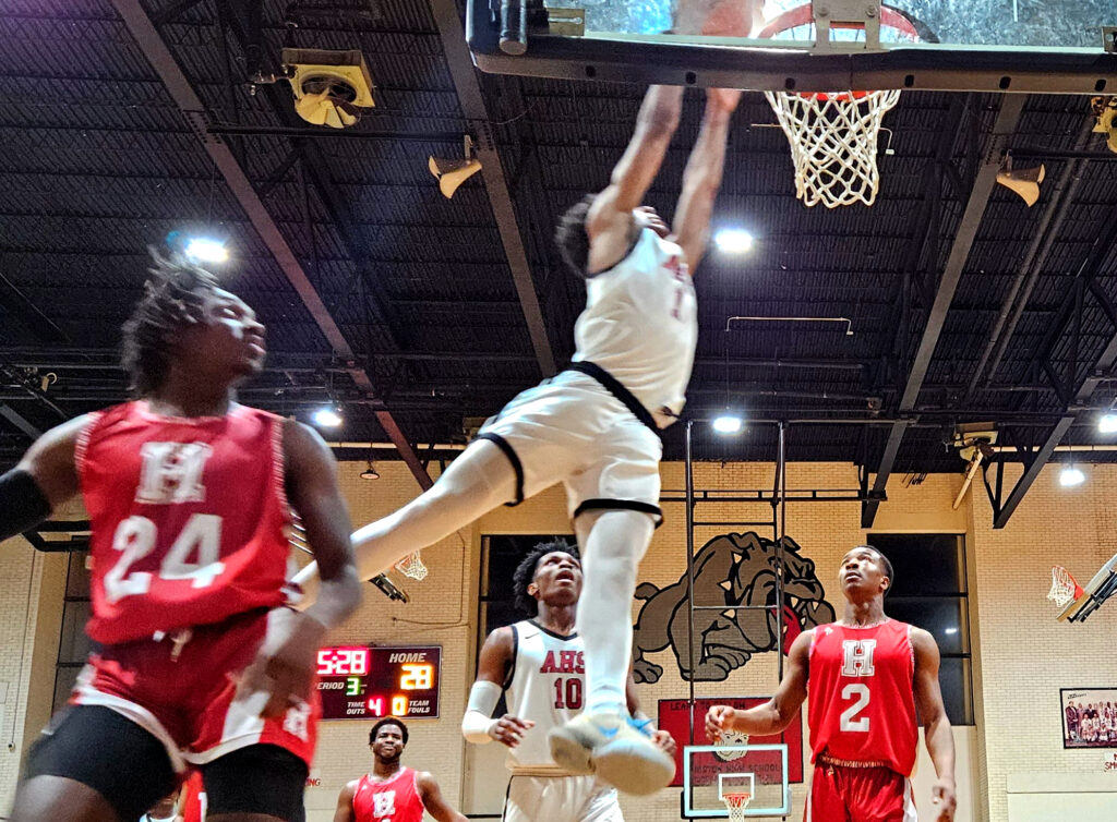 Anniston’s Isaiah Allen drives the baseline for a dunk against Handley on Friday. (Photo by Joe Medley)