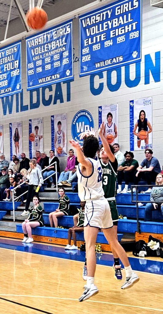 Faith Christian’s Colton Reese hits a 3-pointer as White Plains’ Coleman Ray challenges Friday. (Photo by Joe Medley)