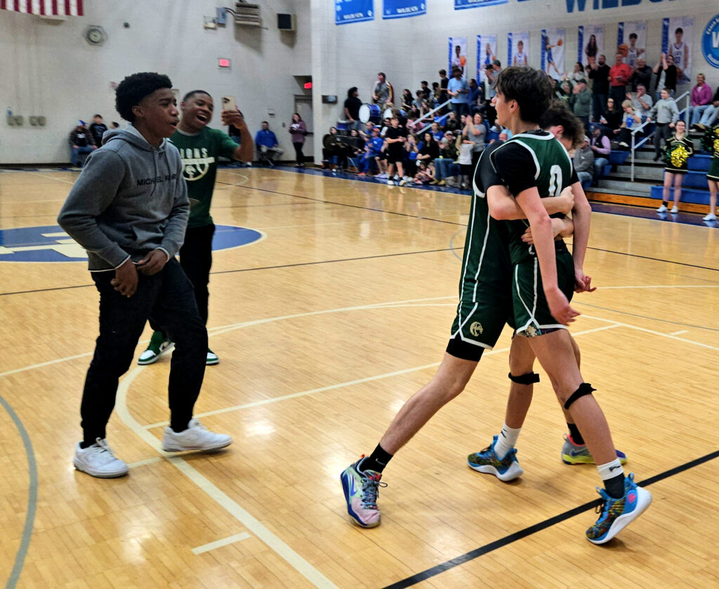 Faith Christian players celebrate after winning Friday at White Plains. (Photo by Joe Medley)