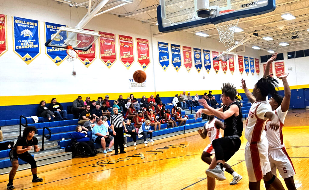 Weaver’s Harper Williams fires a pass out to Gabe King during the Bearcats’ victory over Saks in the Class 3A, Area 11 semifinals on Saturday at Piedmont. (Photo by Joe Medley)