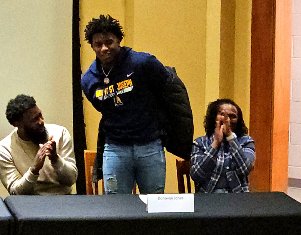 Oxford’s Donovan Jones reveals his college choice during Oxford’s National Signing Day ceremony Wednesday. (Photo by Joe Medley)