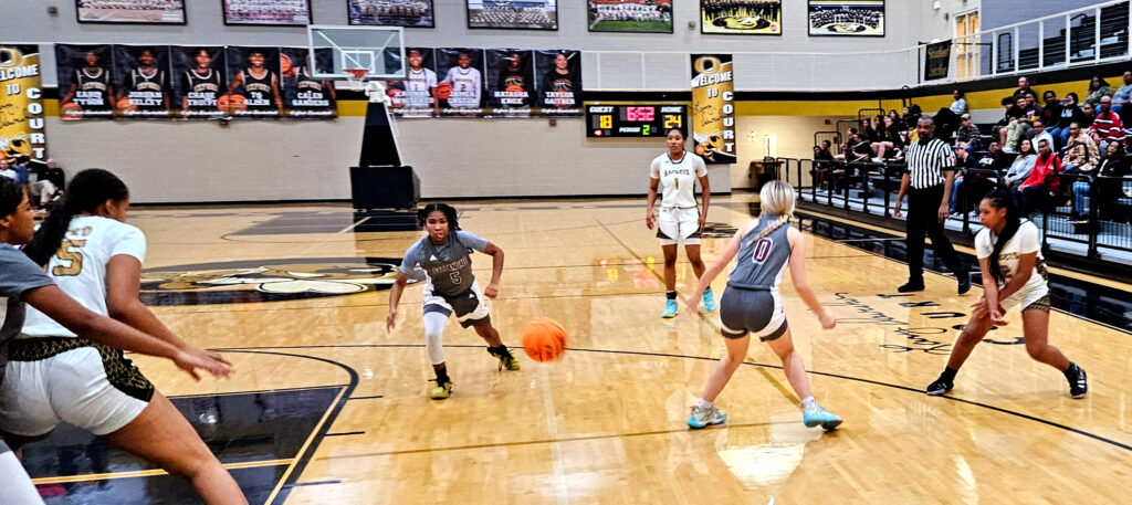 Oxford’s JaMea Gaston fires a pass between Gardendale’s Davonna Everette (5) and Chloe Sanders (0) for teammate Shay Montgomery (left) during Friday’s Class 6A Northeast subregional at Oxford. (Photo by Joe Medley)