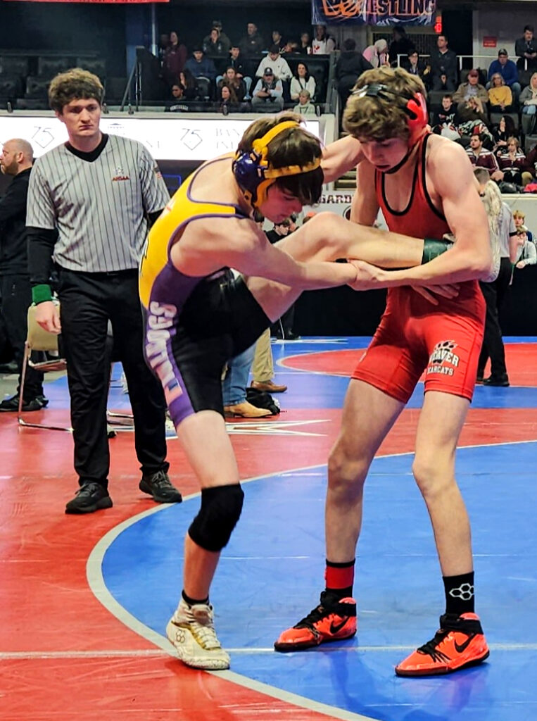 Weaver’s Cael Fulmer and Ranburne’s Carter Driver battle during their Class 1A-4A 106-pound championship final Saturday in Huntsville’s Von Braun Center. (Photo by Joe Medley)