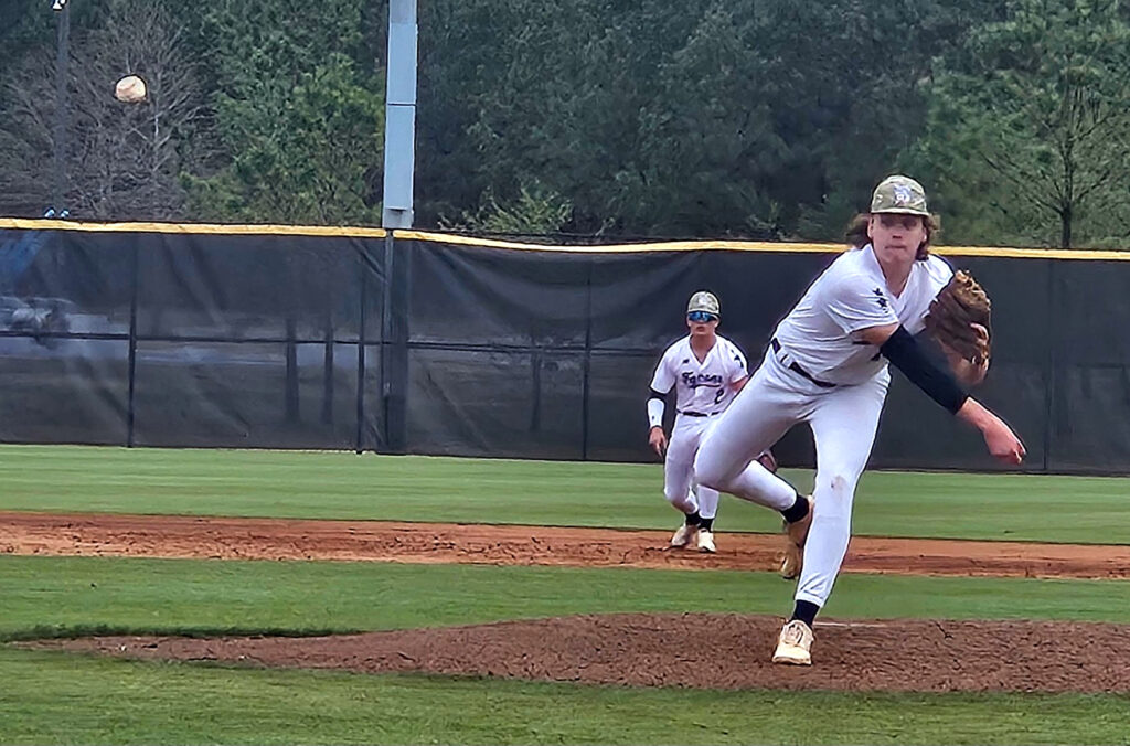 Donoho’s Kai Cleckler follows through on a pitch against Jacksonville Christian during Saturday’s Calhoun County tournament action at Choccolocco Park. (Photo by Joe Medley)