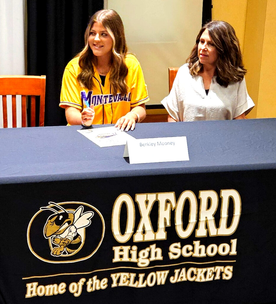 Berkley Mooney and her mom at Monday’s signing ceremony.
