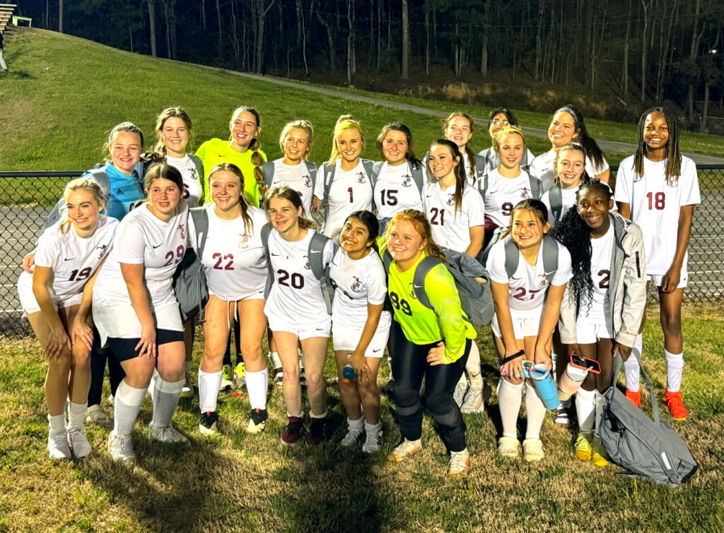 Donoho’s girls celebrate Wednesday after winning at Saks. (Submitted photo)