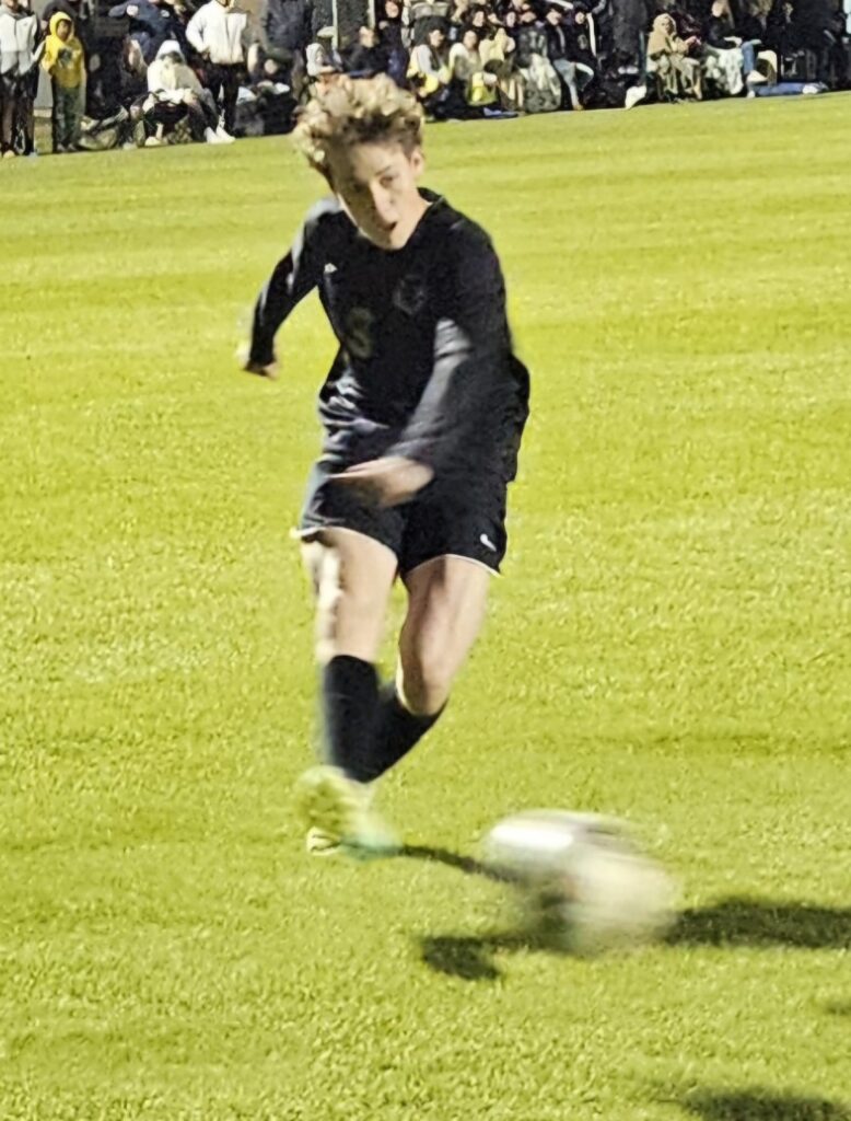 Oxford’s Tristen Koontz fires a shot against Donoho during Thursday’s boys’ Calhoun County soccer final at Choccolocco Park. (Photo by Joe Medley)