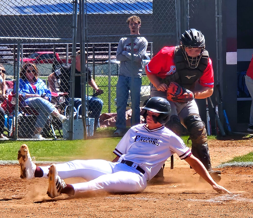 Hayes Farrell slides home for a run against Pleasant Valley on Saturday. (Photo by Joe Medley)